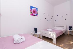 Posteľ alebo postele v izbe v ubytovaní Apartman Sun Solin