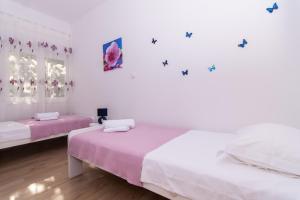 Posteľ alebo postele v izbe v ubytovaní Apartman Sun Solin