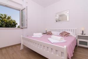 Posteľ alebo postele v izbe v ubytovaní Apartman Sun Solin