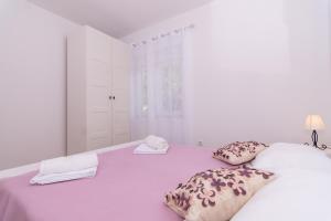Posteľ alebo postele v izbe v ubytovaní Apartman Sun Solin