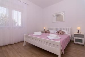 Posteľ alebo postele v izbe v ubytovaní Apartman Sun Solin