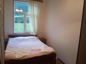 Postel nebo postele na pokoji v ubytování Guest House Tavaduri