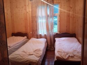 Postel nebo postele na pokoji v ubytování Guest House Tavaduri