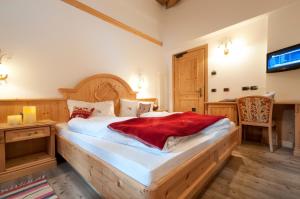 Ένα ή περισσότερα κρεβάτια σε δωμάτιο στο Hotel Gianna