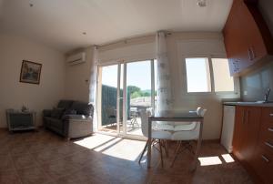 Posezení v ubytování Apartament Can Jaumató + 4 fotografie