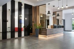 an office lobby with black and white striped walls at HOMER Bydgoszcz Ośrodek Rehabilitacji i Szkolenia PZN in Bydgoszcz
