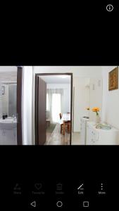 a bathroom with a mirror and a sink in a room at Apartment Luskino 22 in Matulji