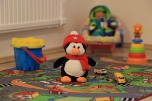 a toy penguin is sitting on a table at Chalupa U první skály in Chřibská