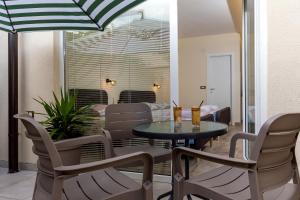 a dining room with a table and chairs at Bitrak Guest House in Ohrid