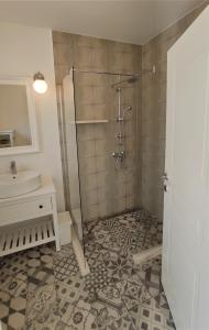 a bathroom with a shower and a sink at ARIA in Sumartin +25 photos