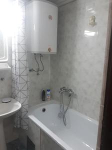 a bathroom with a white tub and a sink at Apartment Tijana in Sutomore +41 photos