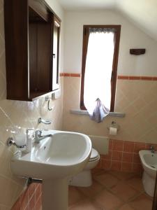 Koupelna v ubytování TERRAZZA SUL MARE wifi e piscina + 30 fotografií
