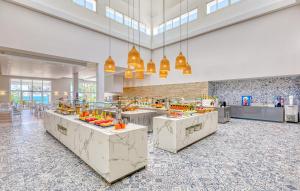 a cafeteria with a buffet line with fruits on display at Senator Puerto Plata in San Felipe de Puerto Plata