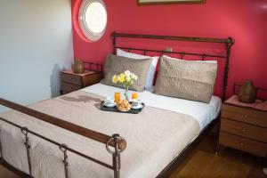 A bed or beds in a room at Villa Olympia VIP Még 37 kép