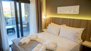 Posteľ alebo postele v izbe v ubytovaní Agnes Deluxe Hotel