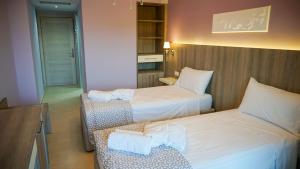 Posteľ alebo postele v izbe v ubytovaní Agnes Deluxe Hotel