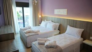 Posteľ alebo postele v izbe v ubytovaní Agnes Deluxe Hotel