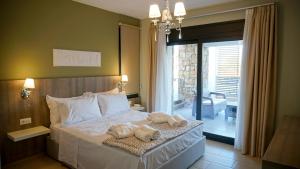 Postel nebo postele na pokoji v ubytování Agnes Deluxe Hotel