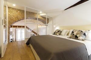 מיטה או מיטות בחדר ב-Casa Marene Ortigia