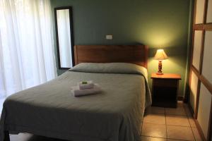 Voodi või voodid majutusasutuse Hotel Guadalupe toas