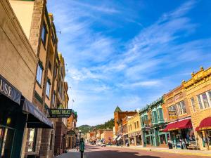 an empty street in a small town with buildings at Mineral Palace Hotel & Gaming in Deadwood