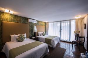 Postel nebo postele na pokoji v ubytování Colombe Hotel Boutique
