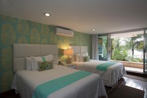 Postel nebo postele na pokoji v ubytování Colombe Hotel Boutique