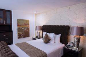 Postel nebo postele na pokoji v ubytování Colombe Hotel Boutique