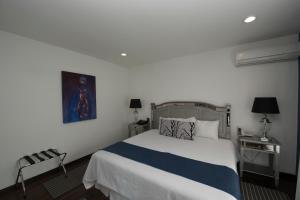Postel nebo postele na pokoji v ubytování Colombe Hotel Boutique + 37 fotografií