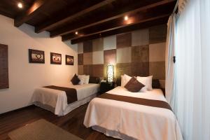 Postel nebo postele na pokoji v ubytování Colombe Hotel Boutique
