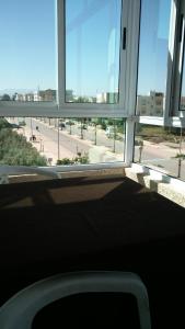 a window in a building with a view of a street at LES CHRIFIs ETAPE AÉROPORT NAVETTE AÉROPORT GRATUITE in Fès