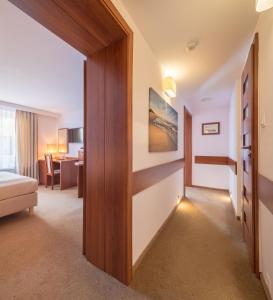 a hotel room with a door leading to a bedroom at Rancho Willa & Restaurant in Rewal +16 photos