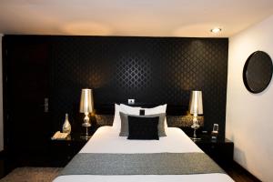 Postel nebo postele na pokoji v ubytování Colombe Hotel Boutique