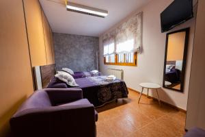 Giường trong phòng chung tại Apartamento Turístico San Jorge Parking Privado Gratis
