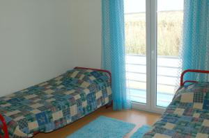 Ein Bett oder Betten in einem Zimmer der Unterkunft Baleal Family apartment