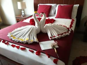 Uma cama ou camas num quarto em Hotel Onix Gold