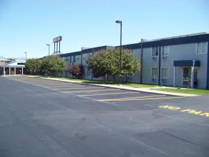 an empty parking lot in front of a building at Aero Inn in Kalispell