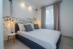 FK Apartments客房内的一张或多张床位