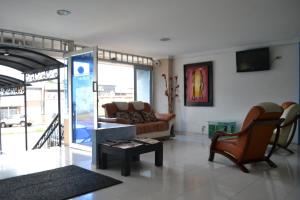 a living room with a couch and a table at Diamante Blue Hotel in Villavicencio