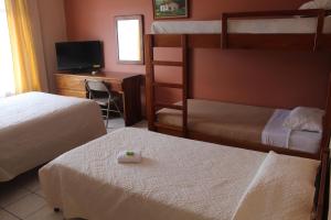 Voodi või voodid majutusasutuse Hotel Guadalupe toas