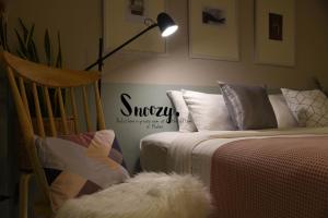 Postel nebo postele na pokoji v ubytování Snoozy Guesthouse