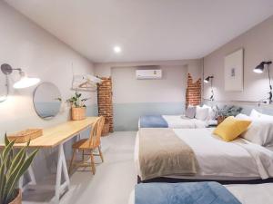 Postel nebo postele na pokoji v ubytování Snoozy Guesthouse