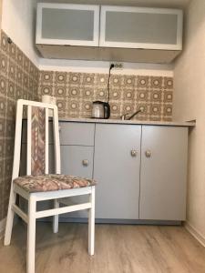 مطبخ أو مطبخ صغير في Cozy Apartment