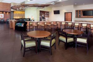 a kitchen with a dining room table and chairs at Hyatt Place Phoenix/ Mesa in Mesa