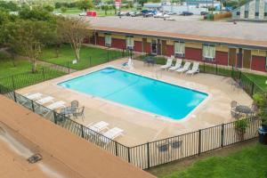 an overhead view of a swimming pool at a hotel at Rodeway Inn in Georgetown