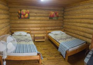 A bed or beds in a room at Svetlana