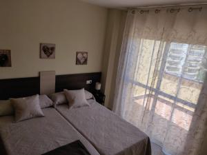 Posteľ alebo postele v izbe v ubytovaní ÁTICO VISTAMAR penthouse with views