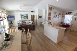 a living room with a couch and a table at Villa Willow Wood - Golfcourse in Inverness