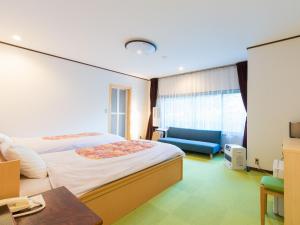 Кровать или кровати в номере Ikoisanso