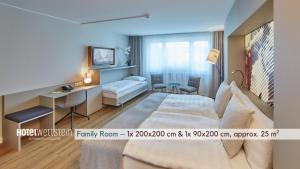 Un pat sau paturi într-o cameră la Hotel Wettstein